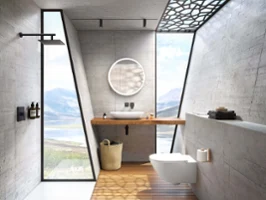 Une salle de bains moderne avec des murs en béton, grande fenêtre donnant sur un lac, un miroir rond Subway 3.0 et une vasque à poser blanche Loop & Friends