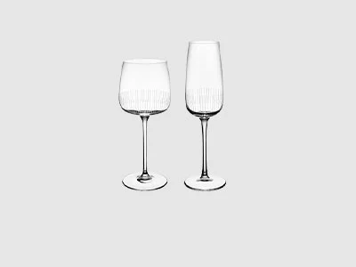 Image de la collection - Verres Afina Un verre à vin et une flûte à champagne sont placés côte à côte sur un fond gris clair sobre.