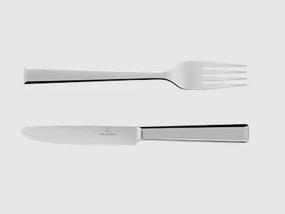Image de la collection - Victor Une fourchette et un couteau en acier inoxydable sont placés parallèlement l'un à l'autre sur un fond sobre et clair.