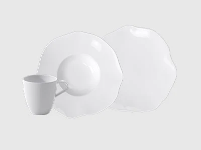 Collection image - Pura An arrangement of two plates and a cup, pura, presented on a light background.