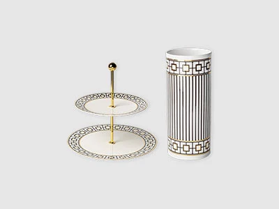 Image de la collection - Décoration MetroChic Présentoir à dessert à deux étages et haut vase cylindrique, tous deux blancs avec des motifs géométriques noirs et des accents dorés.