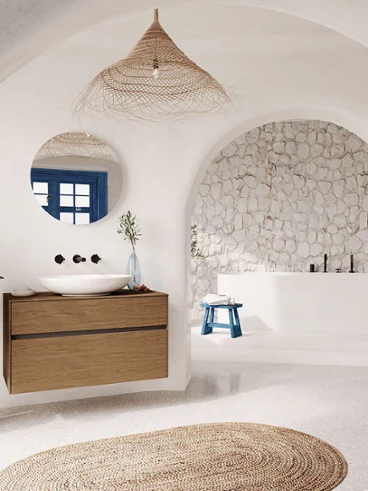 Un lavabo Loop & Friends dans une salle de bains de style Santorin Une salle de bains blanche avec une arche et un lavabo blanc Loop & Friends.