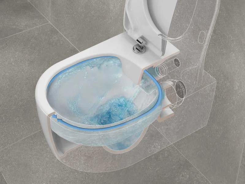 Représentation de DirectFlush dans des WC Vue en coupe de WC modernes montrant l’écoulement de l’eau lorsque la chasse d’eau est tirée, avec de l’eau bleue tourbillonnant dans la cuvette.